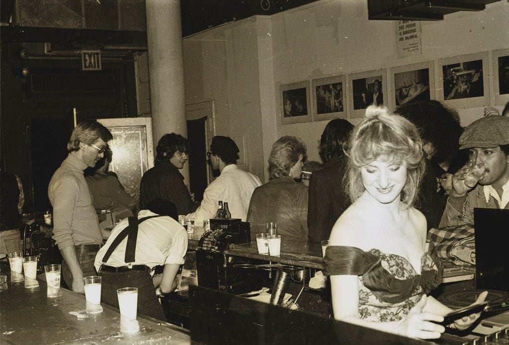 Anita Sarko DJ-ing at the Mudd Club, ca. 1980. Photograph by and courtesy of Scott Morgan.